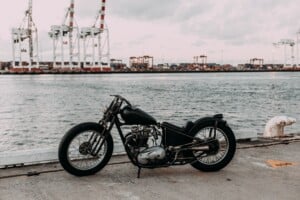 Motorcycle sitting by the water